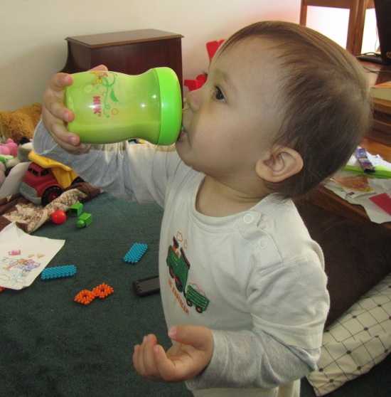 Feeding himself Pediasure in a sippy cup