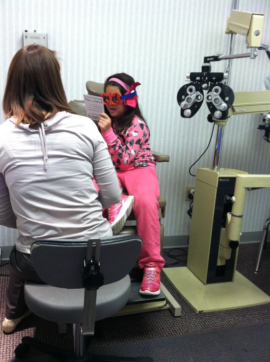 Getting her eyes tested