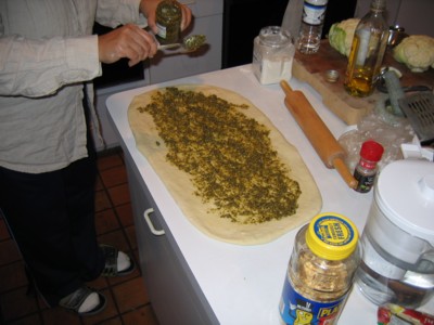 Pesto spread on the dough