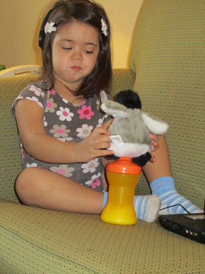 Diego the penguin wants to sit on the sippy cup
