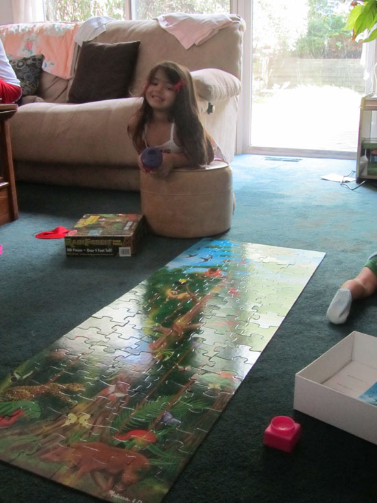 Yaya shows off her assembled new Rainforest puzzle (Thank you Lil!)