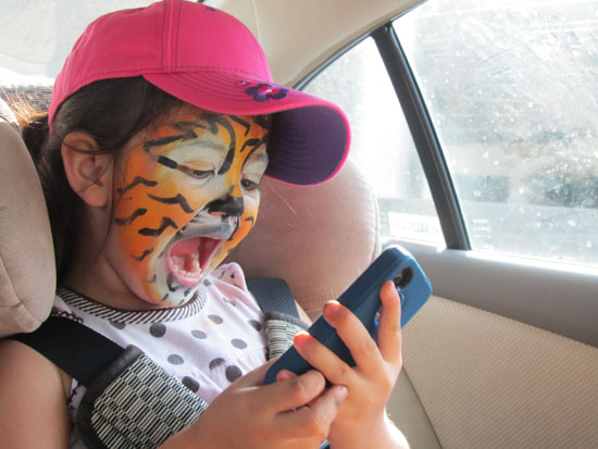 Tiger roaring and taking pictures of herself