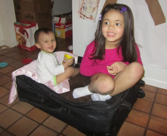 Where could they possibly think they're going in the suitcase?