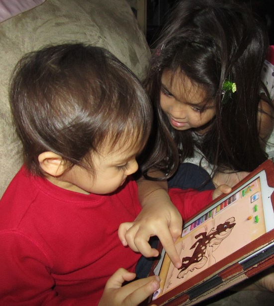 Yaya helps adik with the coloring book app