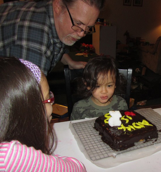 Papa and Adik blow out his candle