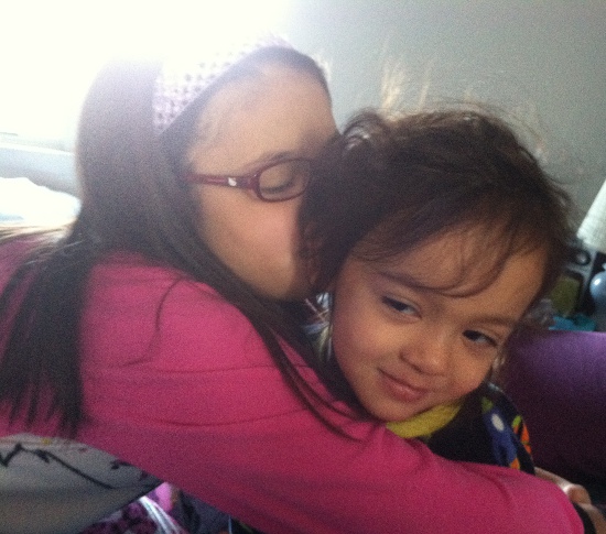 Yaya gives Adik a birthday hug and kiss