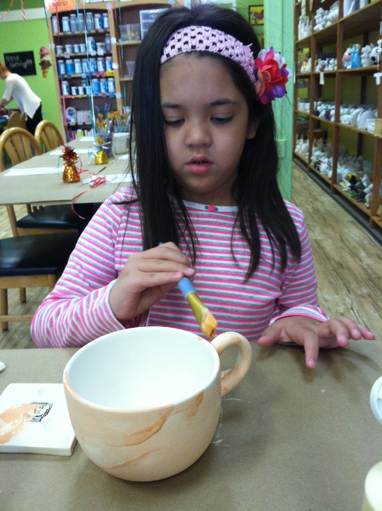Hard at work painting a new teacup for Papa