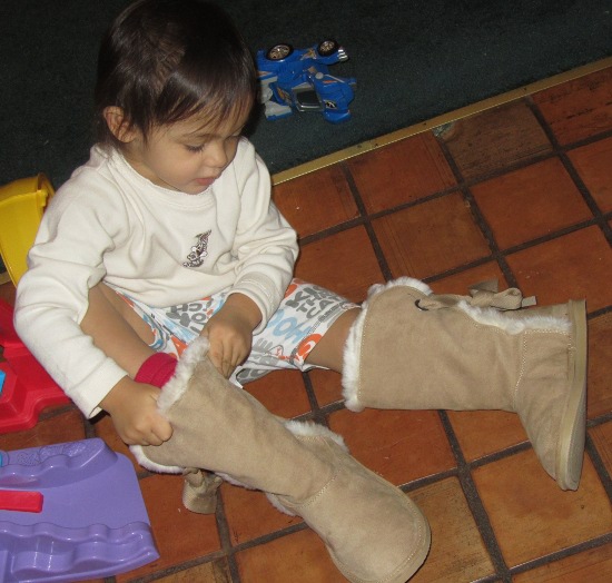Trying on Yaya's new winter boots