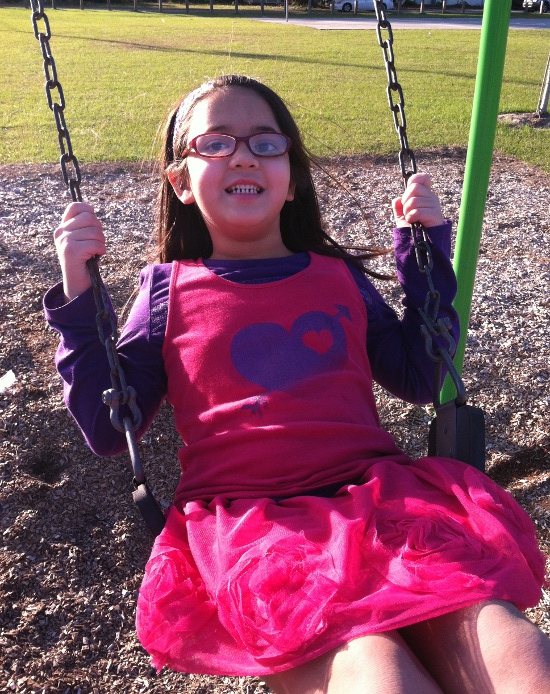 Swinging at a playground in Ocala