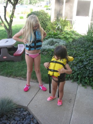 Gabby and Yaya are ready in their lifejackets