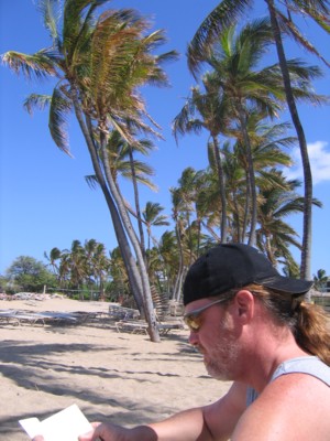 Vin reading under the coconut trees