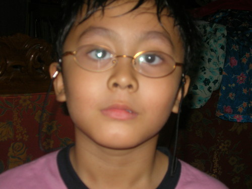 Irfan looks at camera with glasses on