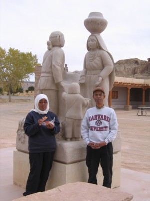 Mak and Abah by a statue