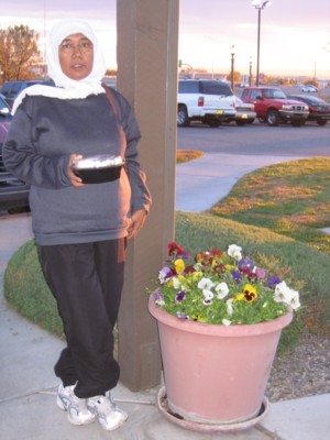 Mak by a planter of pansies (I think)