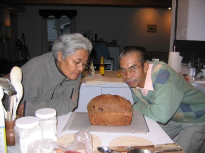 Abah and Mak smelling bread fresh from the oven