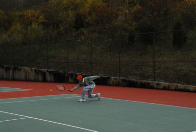 Reaching for a forehand