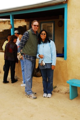 Vin and I by a traditional puebloan house