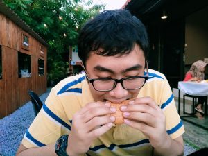 Irfan devours his burger