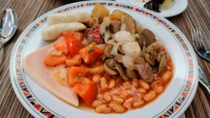 Beans, potatoes, sausages, mushrooms, tomatoes, turkey ham and ONIONS