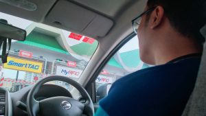 Irfan drives up to the tollbooth