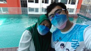 Ain and Irfan by the pool