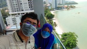 Irfan and Ain final selfie with the beach below