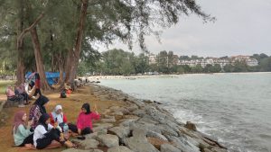 Further down the beach is a hangout area with gazebos