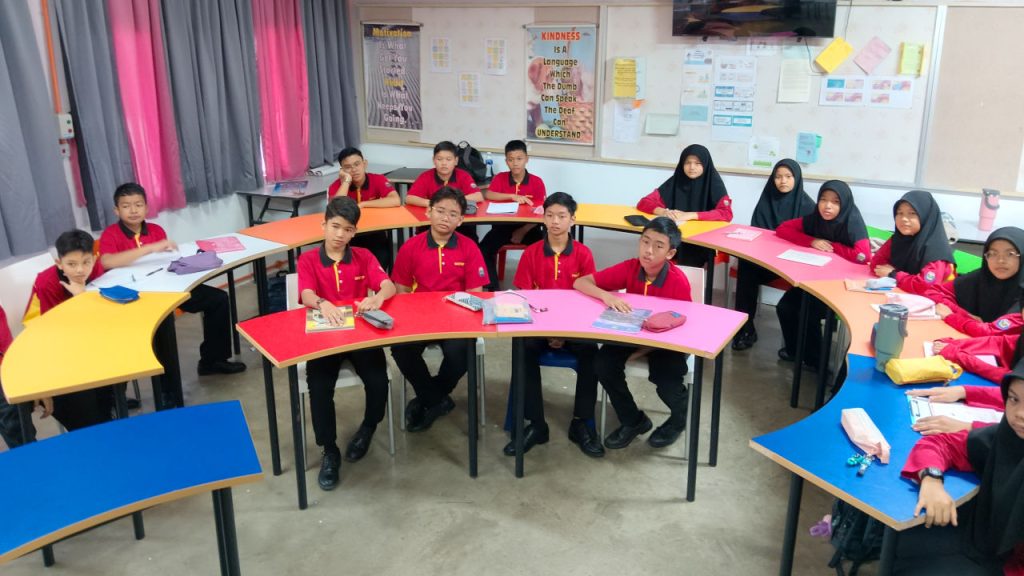 Three groups of students in red uniforms preparing to play Mini Six